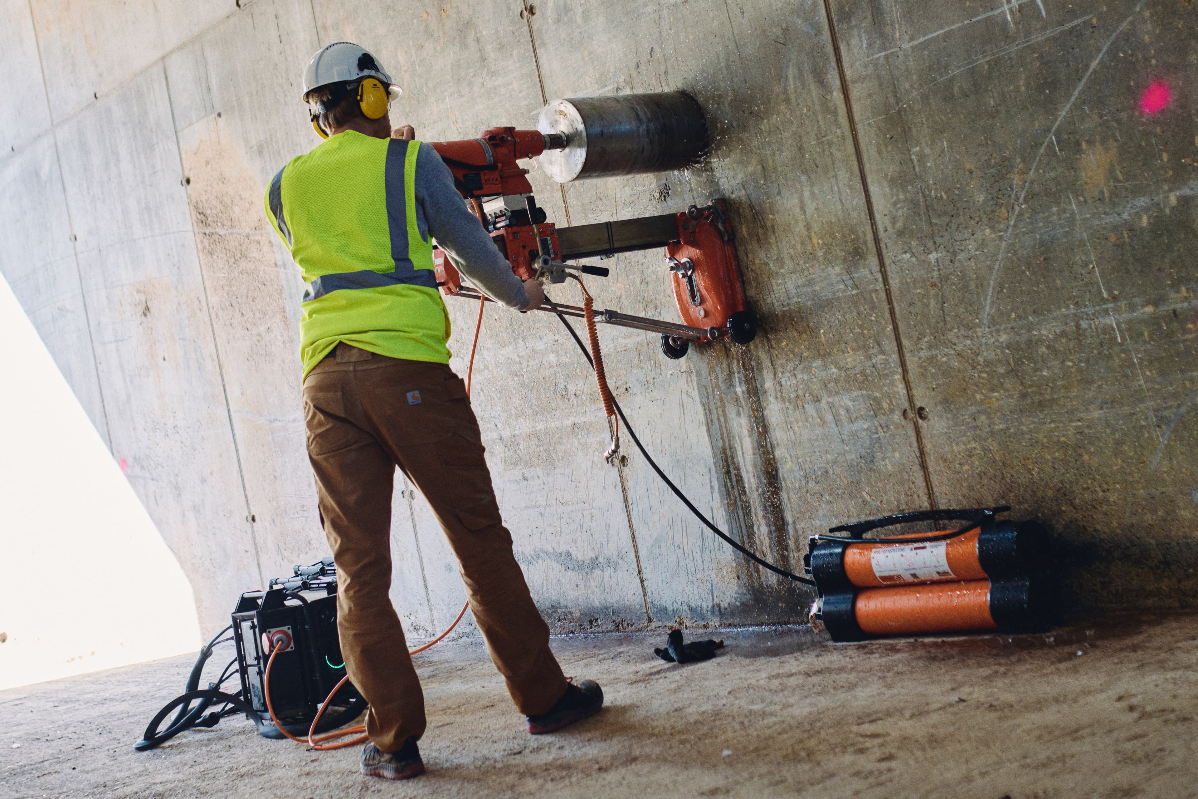 man using diamond core drill with instagrid link unit