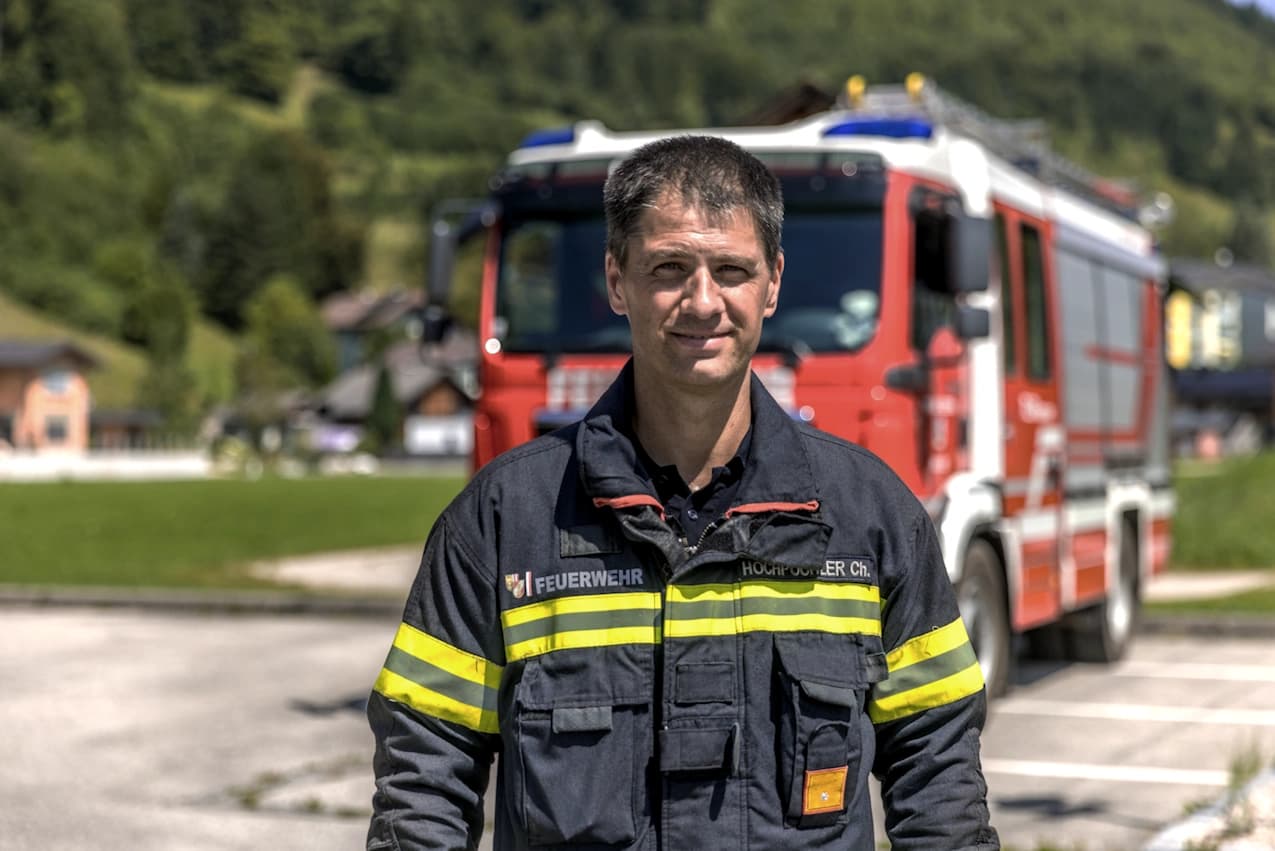 Man in front of a fire truck
